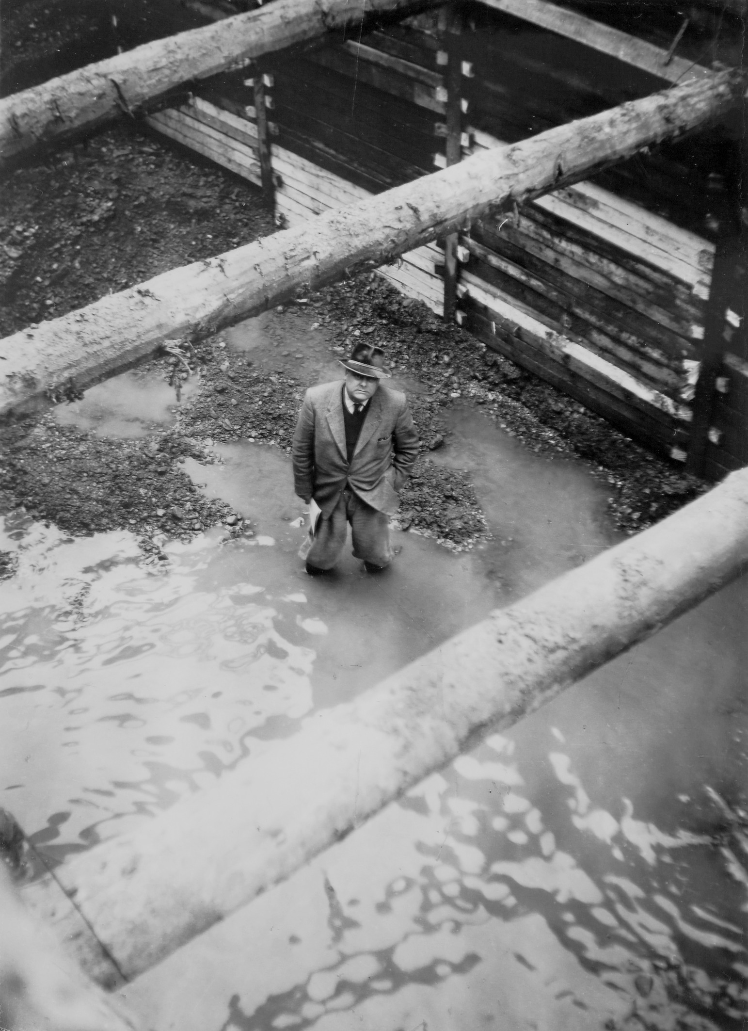 1960: Ingeneer standing in the mud. 