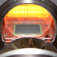 A sample is placed in a red heated oven.
